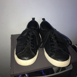 black leather sneakers